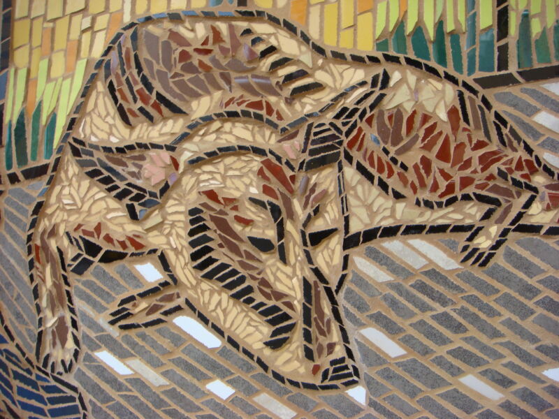 Close-up of a mosaic depicting a sleeping dog.
