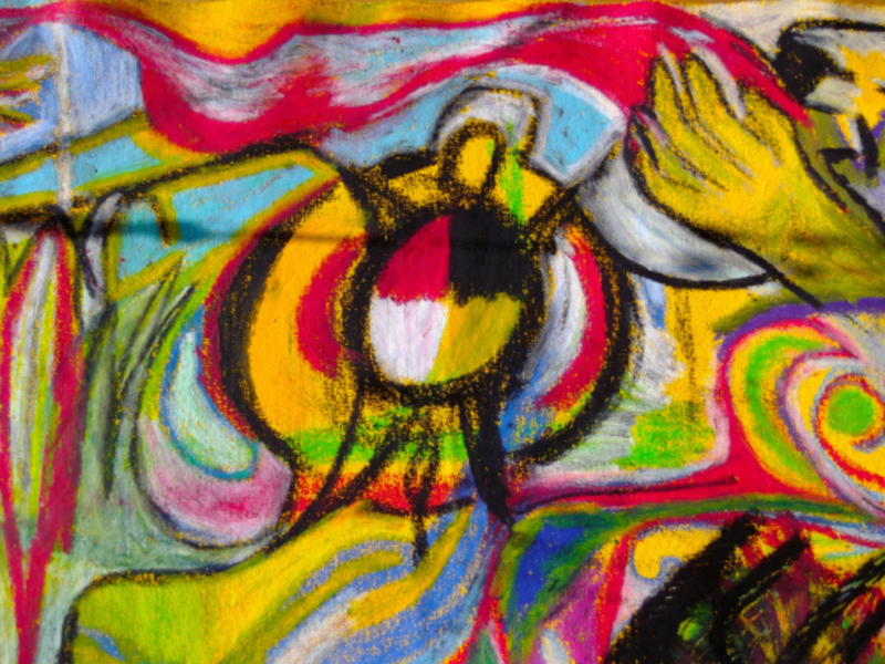 Colourful oil pastel drawing of a turtle, hand, trees, and mountains.