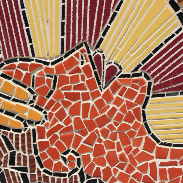Close-up of a mosaic depicting a person laying down, head held in another’s hands.